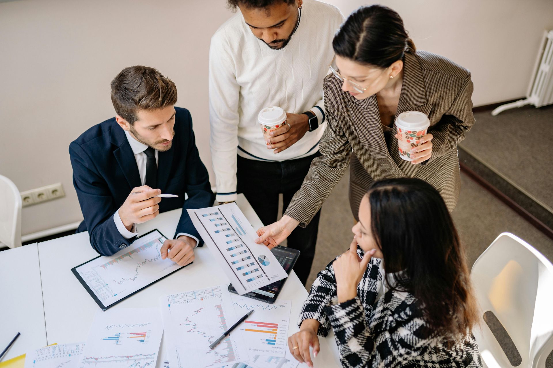 Photo of people working together near a desk